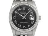 rolex day date watch with black roman numeral dial