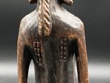 a statue of a woman with a hat on her head