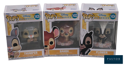 two boxes of pop disney vinyl figures are shown in a row