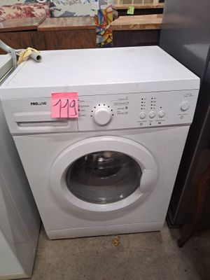 a washer and dryer sitting next to each other in a room