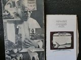 an old photo of a man with a dog and a book
