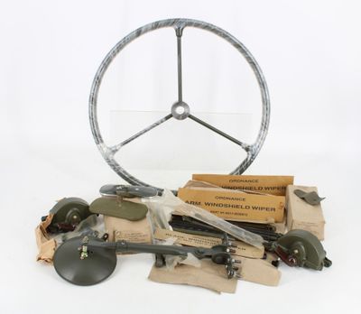 a steering wheel and other items on a table