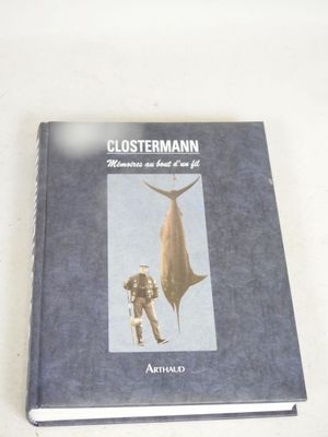 a book with a picture of a man standing next to a shark