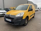 yellow citrole van parked in a parking lot next to other cars