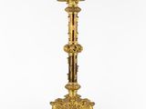 an image of a gold and green candle holder on a white background