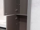 a cabinet that has a sink in it on the floor