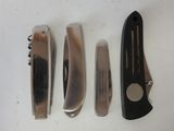four different types of knives are lined up on a white surface
