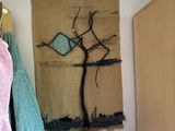 a picture of a towel hanging on a wall next to a radiator