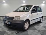 a picture of a small white car parked in a room