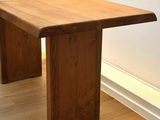 a wooden table that is sitting on a hard wood floor
