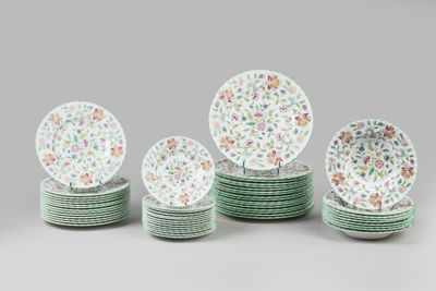 several plates with floral designs are stacked on top of each other