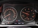 a close up of a car dashboard with a speedometer and gauges