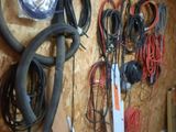 a wall with a bunch of wires hanging on it