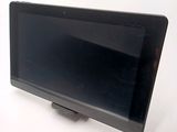 a tablet computer sitting on top of a white table