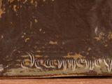 a close up of a brown vase on a table