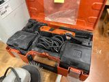 a tool box with tools inside of it on the floor