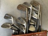 a bag of golf clubs sitting on top of a table