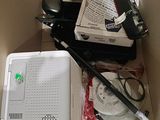 a box with a laptop and other items in it