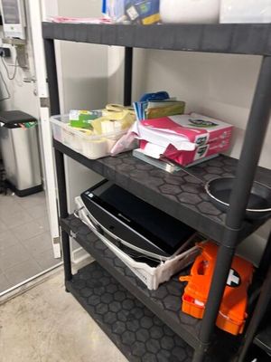 a shelf that has various items on it in a room