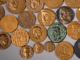 a lot of coins that are on the table