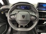 the interior of a car with a steering wheel and dashboard controls