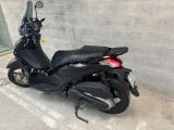a scooter parked on the side of the street