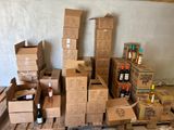a pile of boxes and bottles of wine on a pallet