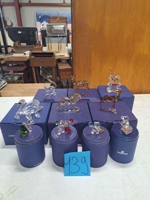 a lot of glass figurines sitting on a table