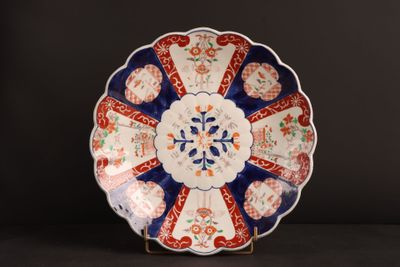 a plate that has a blue and red design on it
