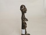 an image of a statue of a man with a bottle of wine