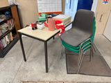 a desk with a chair and a book shelf in the corner
