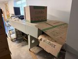boxes are stacked on top of a table in a room