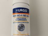a close up of a bottle of deodoranant on a white surface
