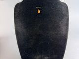 an image of a necklace and earring set on a mannequin