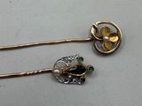 two hair pins that are sitting on a table