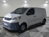 the white van is parked in a large room with a checkered floor