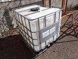 a large white container sitting on top of a metal cart