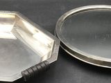 a small mirror sitting on top of a table next to a mirror