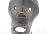 a black mask on a stand on a white background