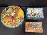 three tins that are sitting on a table