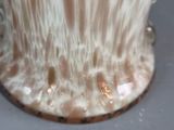 a vase that has water coming out of it