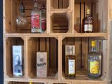 many bottles of liquor on the shelves in the room