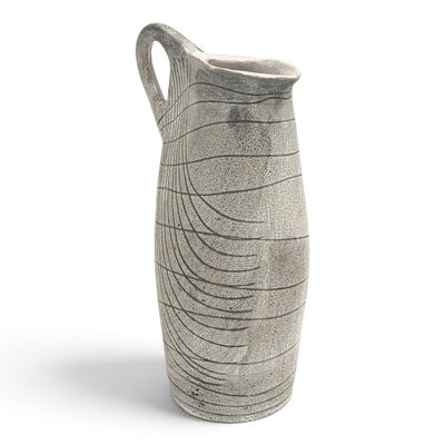 a vase that is sitting on a white surface