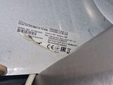 a close up of a piece of metal with a cord attached to it