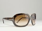 the sunglasses are made of plastic and have brown tinted lenses