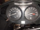 a close up of a speedometer and gauges on a motorcycle