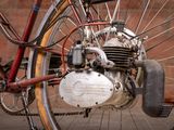 a close up of a motorcycle with a chain attached to it