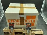 three boxes are stacked on top of each other on the floor