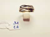 a close up of a ring on a string with a price tag
