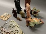 a lot of figurines that are sitting on a table